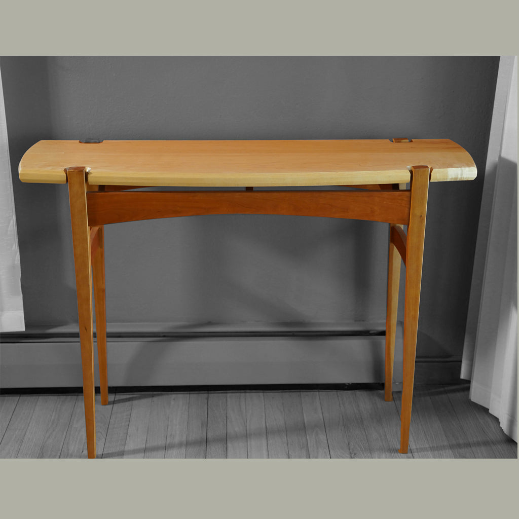 Front view of Maple and Cherry hall table with floating top.