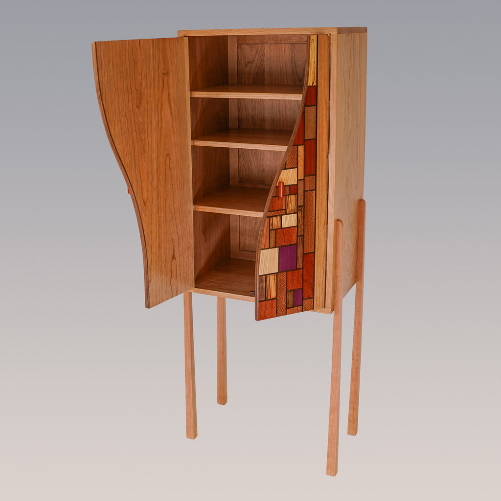 custom wine cabinet of cherry wood with mosaic doors