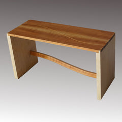 Bench of solid maple and cherry with dovetailed joinery, maple inlay and a curved rail
