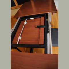 Detail of hidden built in extension for leopardwood dining room table
