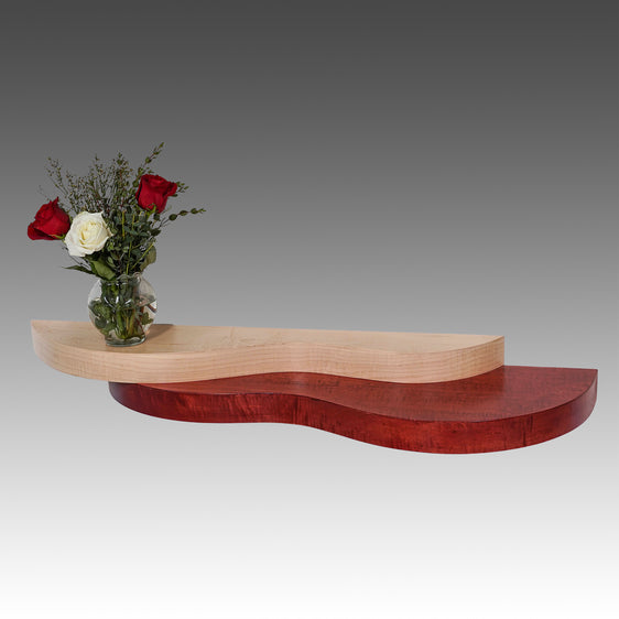 An  display and entryway shelf that is warm and inviting.  Made of natural and stained Maple
