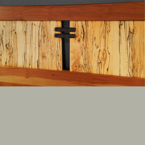 Detail of solid wood Cherry bed headboard with Spalted Maple and Wenge accents