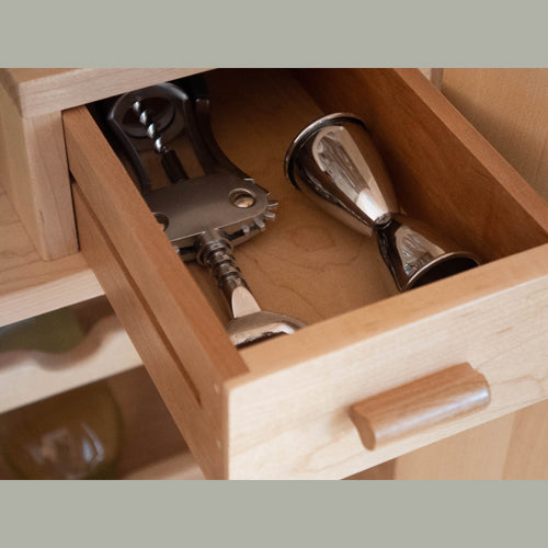 detail of drawer in modern maple wine cabinet
