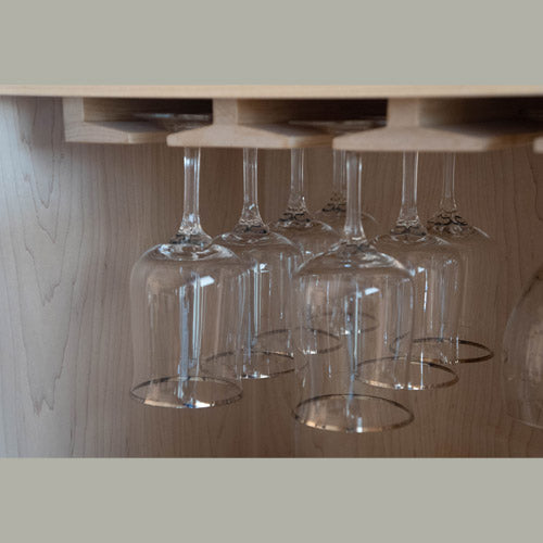 detail of glasses holder in hand crafted maple wine cabinet