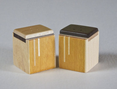 Modern salt and pepper shakers of osage orange wood with a maple inlay,  A great wedding or house gift,