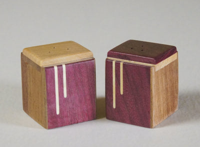 Modern salt and pepper shakers of purplrheart with a maple inlay,  A great wedding or house gift,