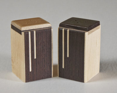 Modern salt and pepper shakers of wenge wood with a maple inlay,  A great wedding or house gift,