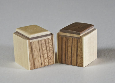 Modern salt and pepper shakers of zebra wood with a maple inlay,  A great wedding or house gift,
